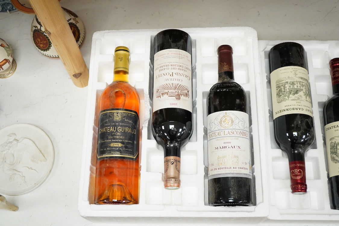 Six bottles of mixed wines, including a bottle of Margaux, Chateau-Lascombes grand cru 2000, a bottle of Larrivet Haut Brion, 2010, two bottles of Chateau Carbonnieux grand cru 2005, a bottle Chateau Grand- Pontet grand